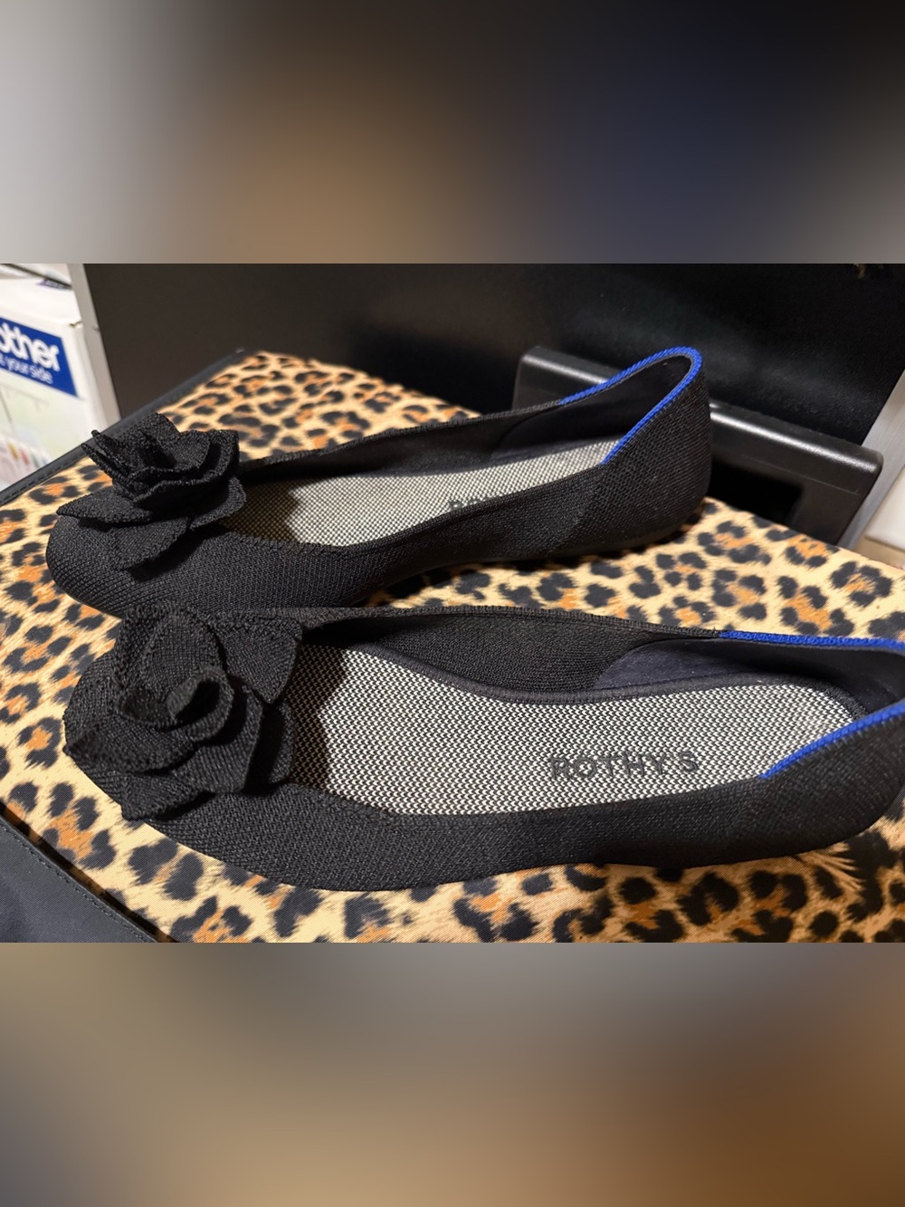 Rothy's Black Knit Floral Appliqué Flats with Blue Trim